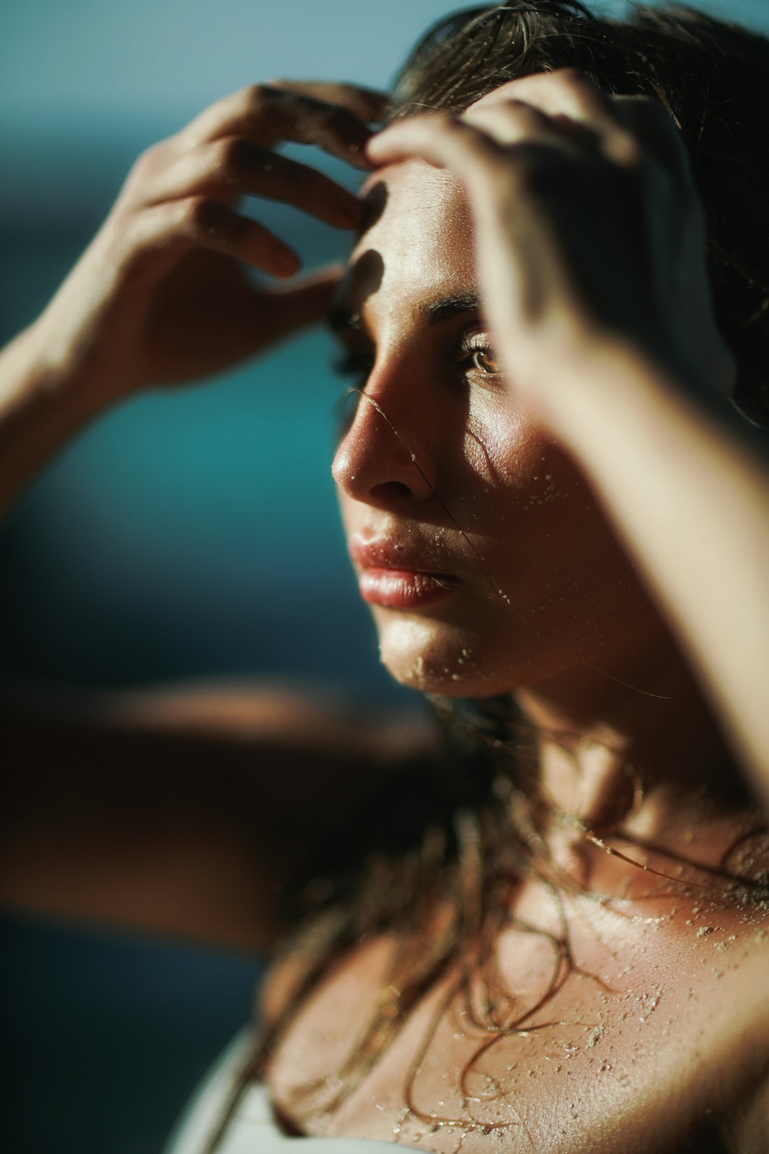 Close-up of woman with wet skin and water droplets following checklist for a sustainable and effective skincare routine