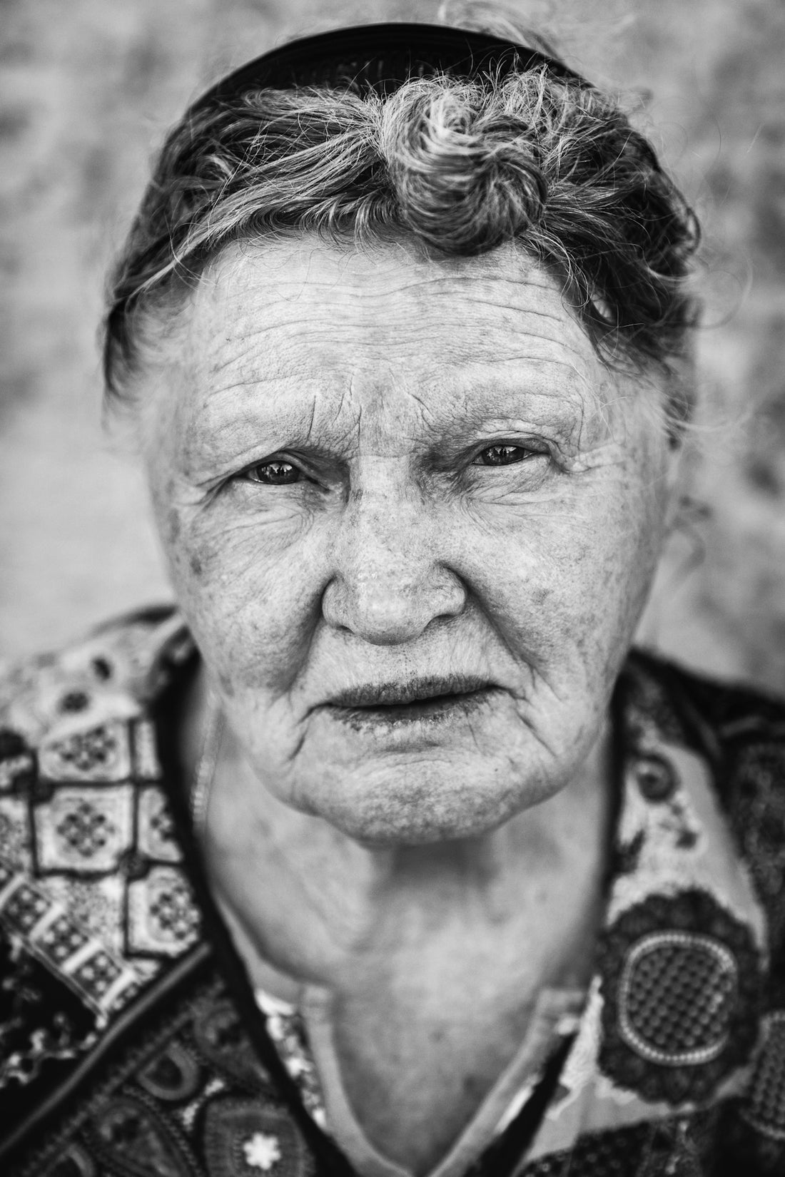 a black and white photo of an old woman