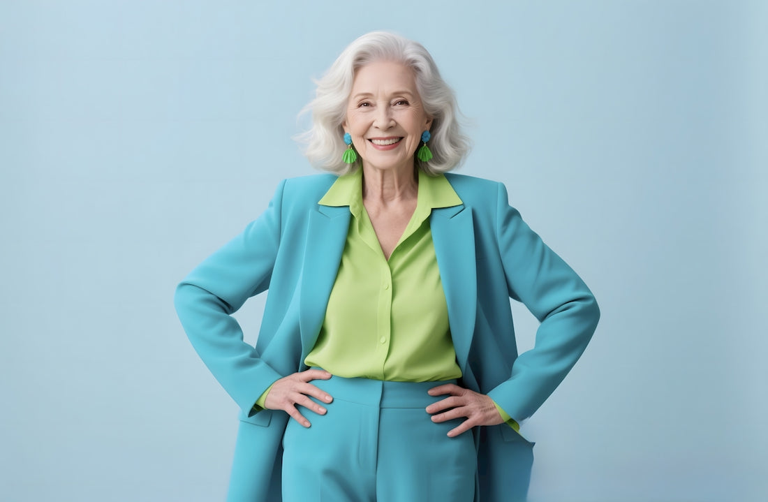 An elegant senior woman confidently poses for a photo.