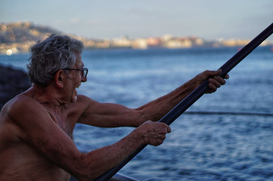 man in black framed eyeglasses holding black stick