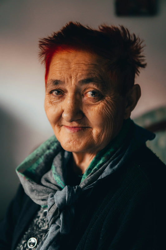 a woman with red hair and a scarf on
